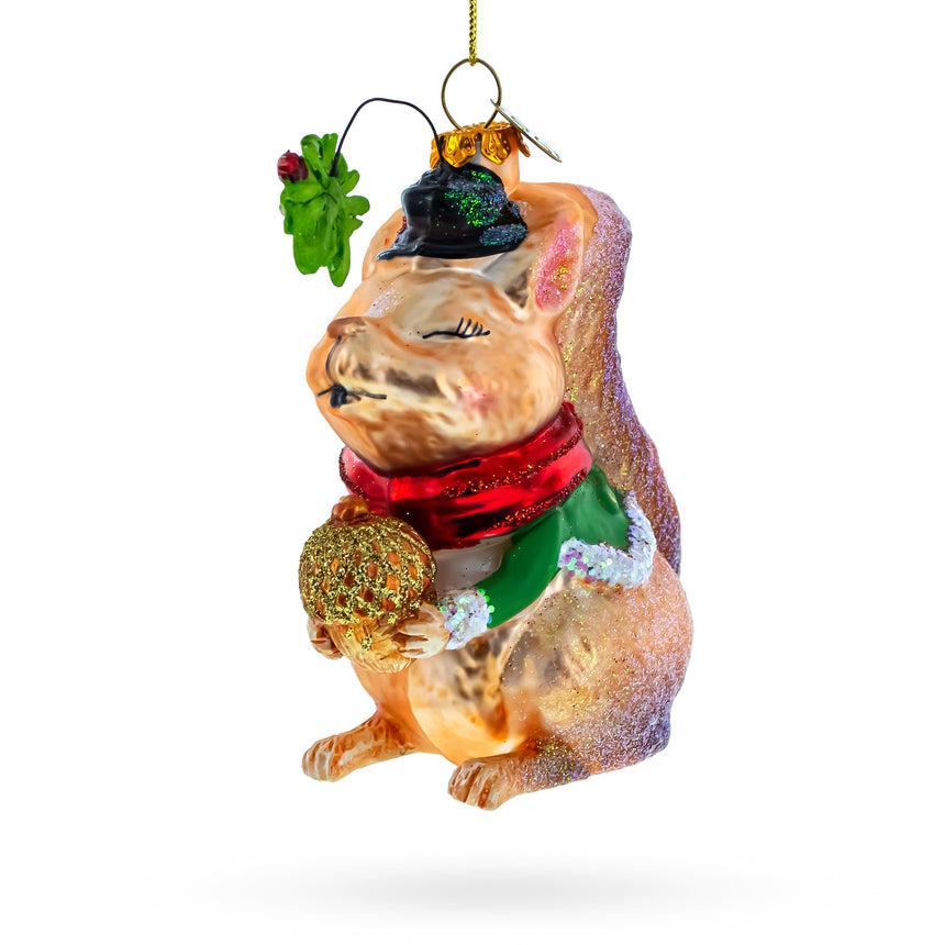 Glass Squirrel Cradling an Acorn Blown Glass Christmas Ornament in Multi color