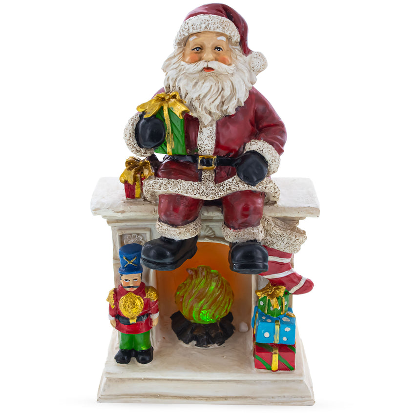 Santa Sitting on a Fireplace LED Lights Figurine 7.75 Inches ,dimensions in inches: 7.75 x 10.15 x 6.28