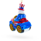 Uncle Sam Santa Driving a Car Blown Glass Christmas Ornament ,dimensions in inches: 4 x 3.25 x