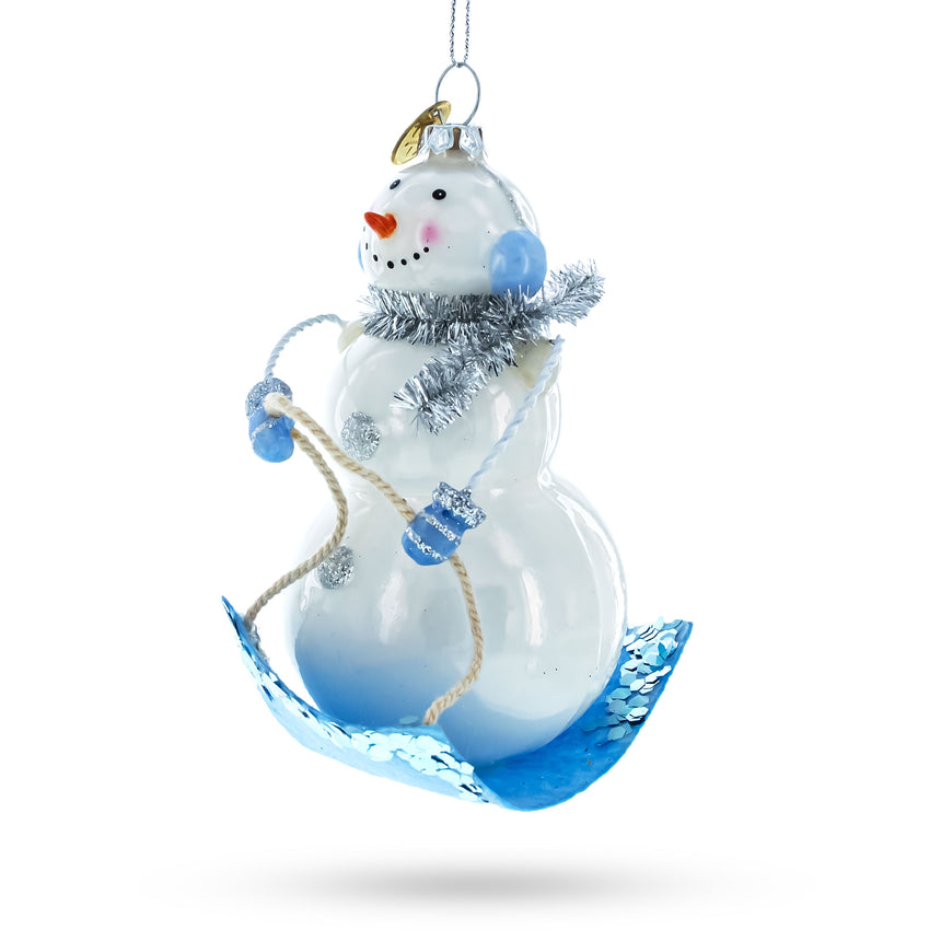 Glass Snowman Riding a Sled Blown Glass Christmas Ornament in Blue color