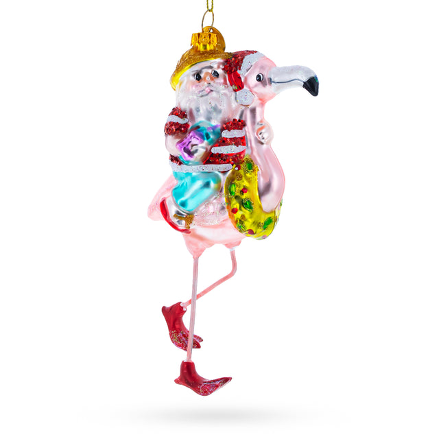 Glass Santa Riding a Pink Flamingo Blown Glass Christmas Ornament in Multi color