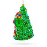 Jolly Santa by Tree Blown Glass Christmas Ornament ,dimensions in inches: 6 x 3.9 x 3.6