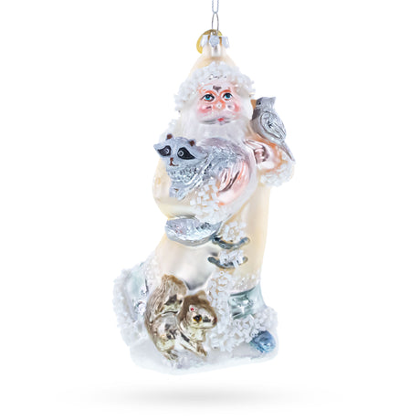 Glass Santa Holding Cardinal and Raccoon Glass Christmas Ornament in White color