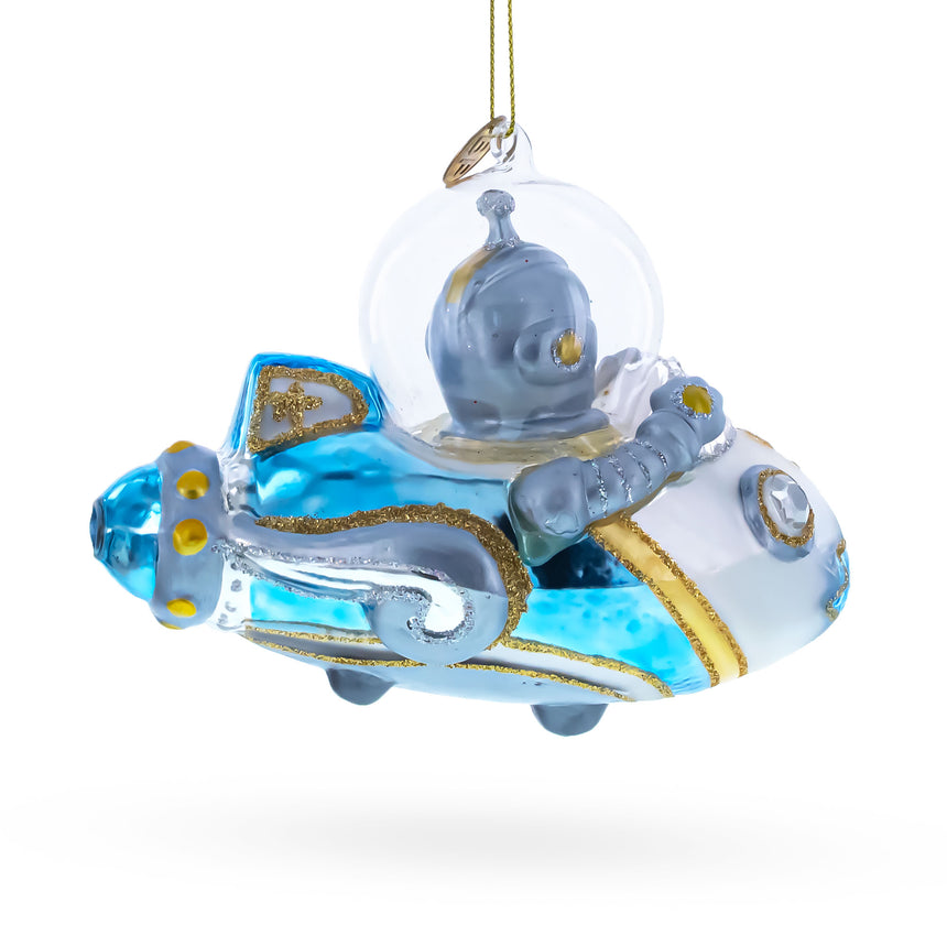 Astronaut Driving Spaceship Blown Glass Christmas Ornament ,dimensions in inches: 3.9 x 2.5 x 2.4