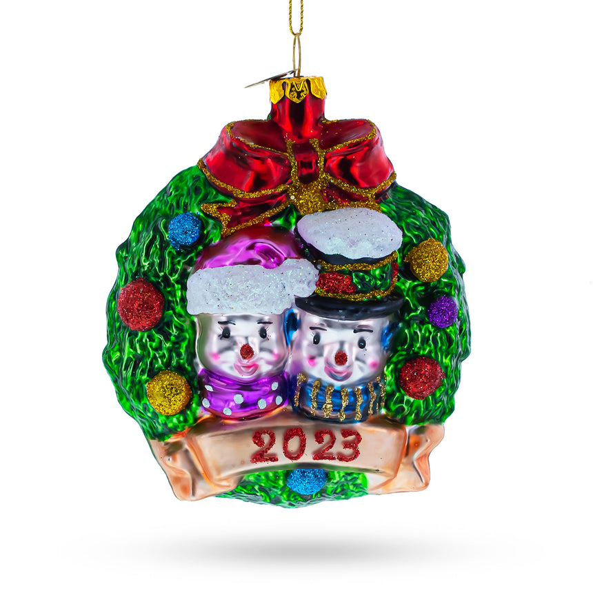 Glass Joyful 2023 Snowmen Couple in Wreath Blown Glass Christmas Ornament in Multi color