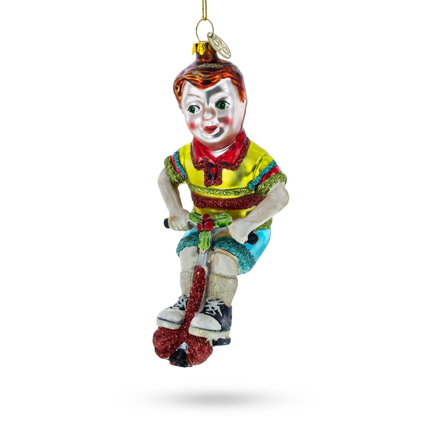 Glass Energetic Boy on Pogo Stick Blown Glass Christmas Ornament in Multi color