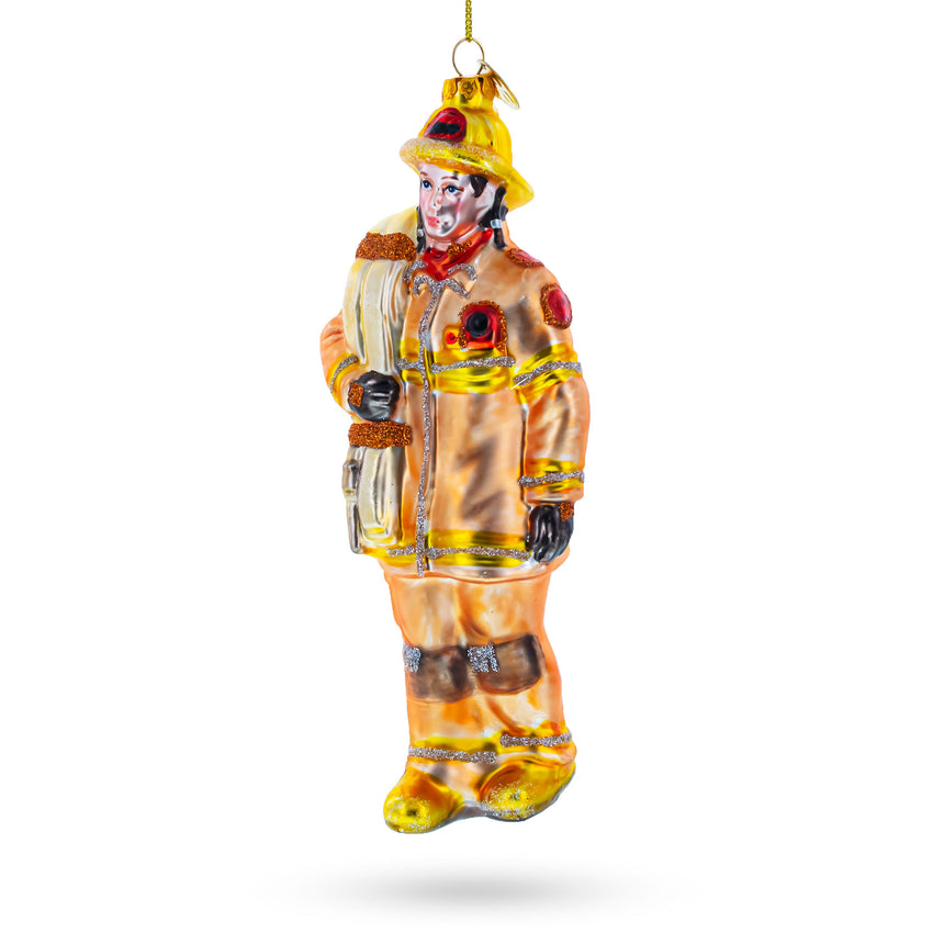 Glass Heroic Fireman with Hose Blown Glass Christmas Ornament in Orange color