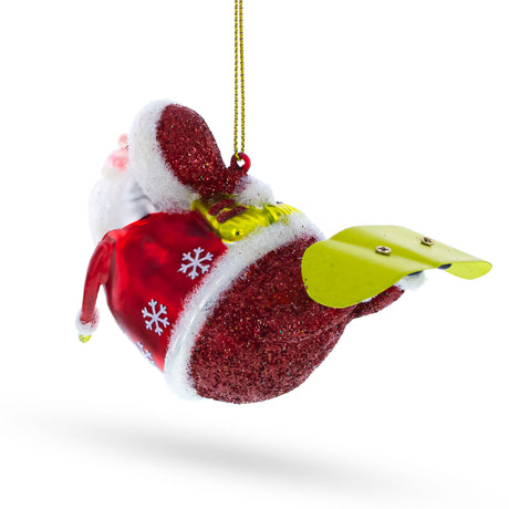 Santa Snowboarding Blown Glass Christmas Ornament ,dimensions in inches: 4.5 x 3 x