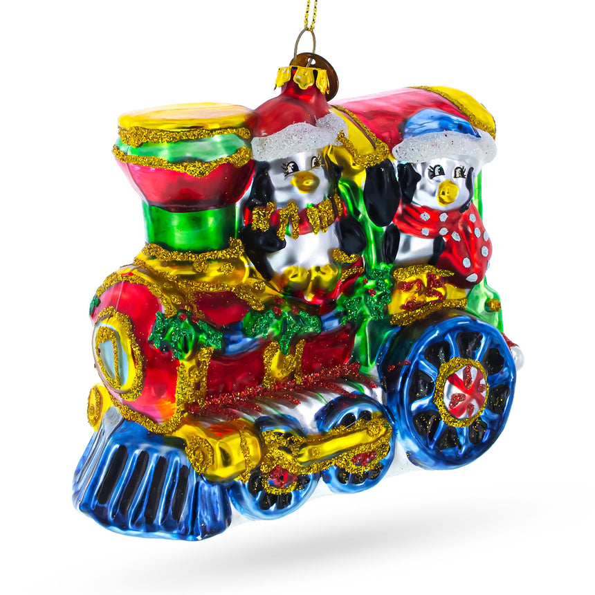 Glass Playful Penguins Riding Train Blown Glass Christmas Ornament in Multi color