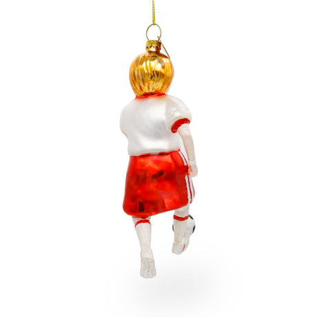 Sporty Girl Playing Soccer Blown Glass Christmas Ornament ,dimensions in inches: 5 x 1.9 x 1.3