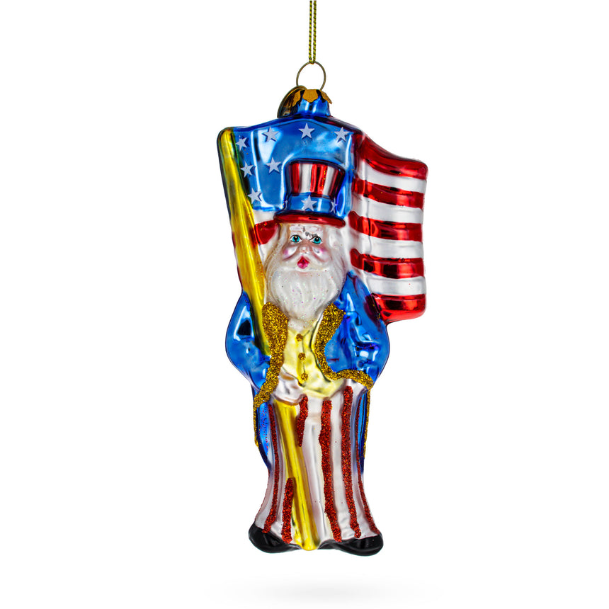 Glass Patriotic Santa Carrying American Flag Blown Glass Christmas Ornament in Multi color