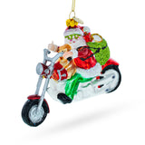 Glass Scooter-Riding Santa Blown Glass Christmas Ornament in Multi color