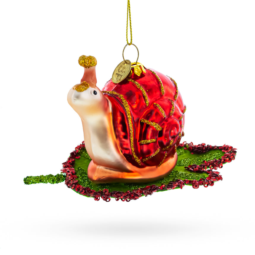 Glass Snail Perched on a Green Leaf Blown Glass Christmas Ornament in Red color