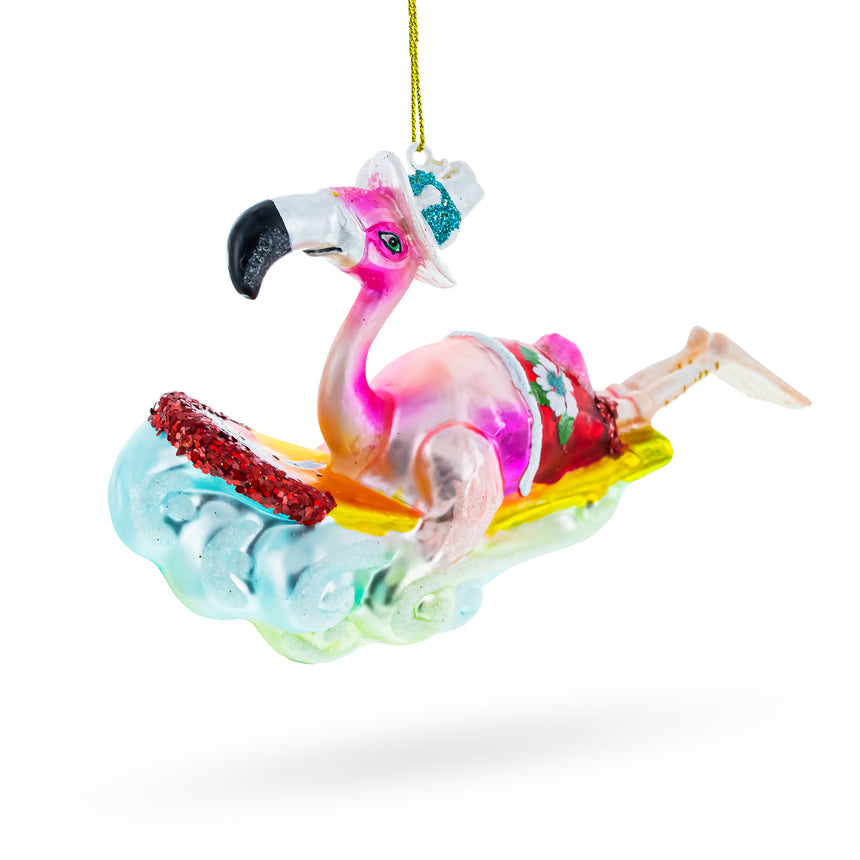 Glass Pink Flamingo Riding a Surf Wave Glass Christmas Ornament in Multi color