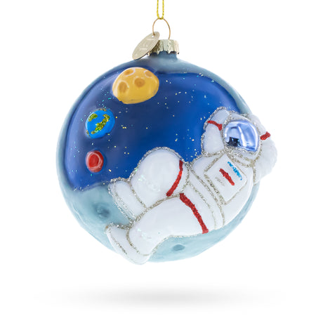 Glass Astronaut on a Moon Blown Glass Christmas Ornament in White color