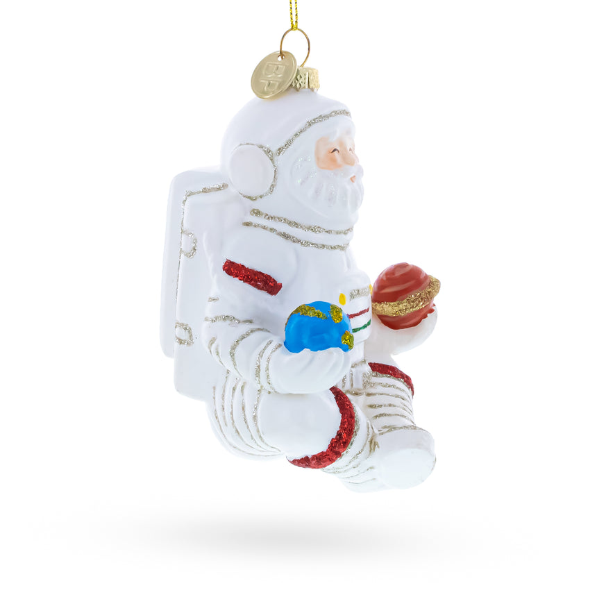 Santa Astronaut Blown Glass Christmas Ornament ,dimensions in inches: 4.7 x 3.3 x 3