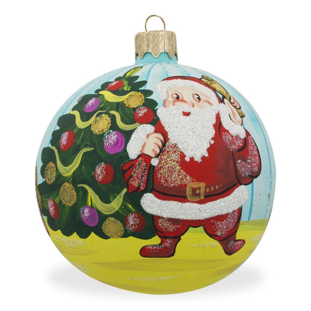 Glass Joyful Santa by Christmas Tree with Gifts Blown Glass Ball Christmas Ornament 3.25 Inches in Multi color Round