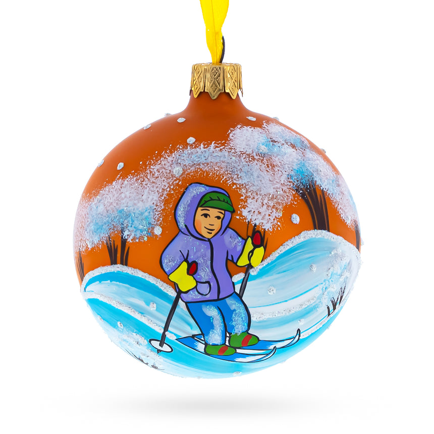 Glass Boy Skiing Blown Glass Ball Christmas Ornament 3.25 Inches in Orange color Round