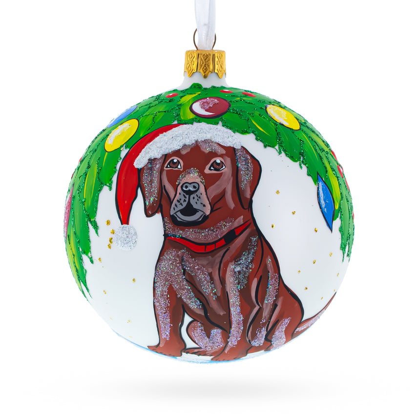 Glass Chocolate Labrador in Festive Santa Hat Glass Ball Christmas Ornament 4 Inches in White color Round