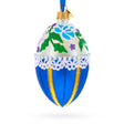 Glass Flowers on Beige and Blue Glass Egg Christmas Ornament 4 Inches in Blue color Oval