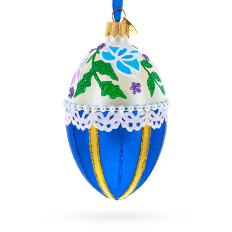 Glass Flowers on Beige and Blue Glass Egg Christmas Ornament 4 Inches in Blue color Oval