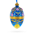 Glass Flowers on Glossy Blue Glass Egg Christmas Ornament 4 Inches in Blue color Oval