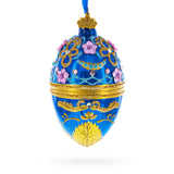 Glass Flowers on Glossy Blue Glass Egg Christmas Ornament 4 Inches in Blue color Oval