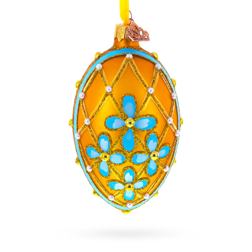 Glass Blue Flowers on Gold Glass Egg Ornament 4 Inches in Yellow color Oval