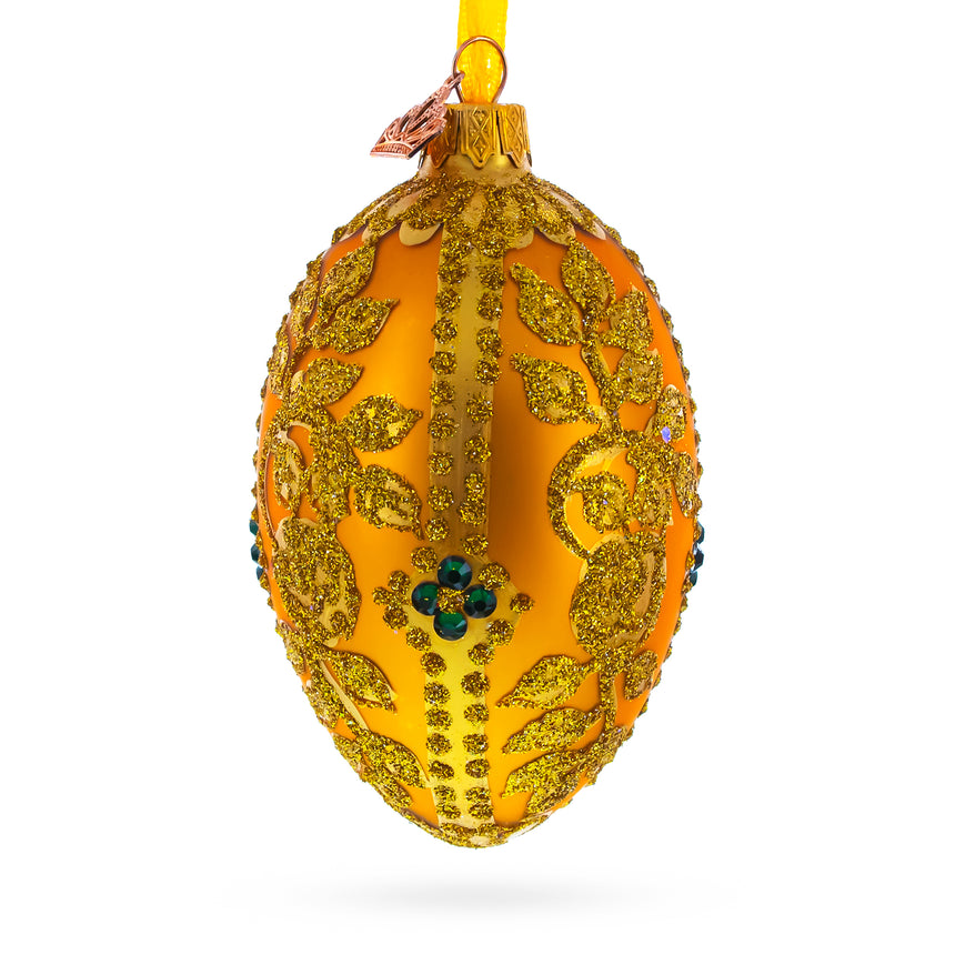 Glass Glittered Golden Leaves Orange Glass Egg Ornament 4 Inches in Gold color Oval