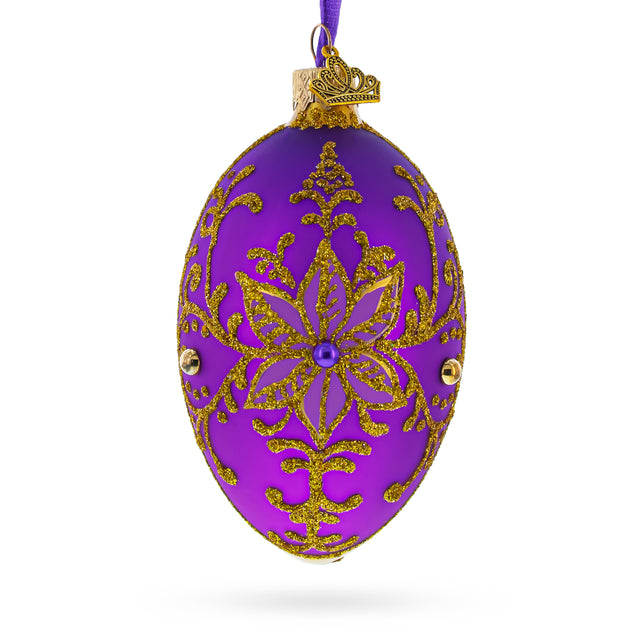 Glass Golden Swirls on Purple Glass Egg Ornament 4 Inches in Purple color Oval