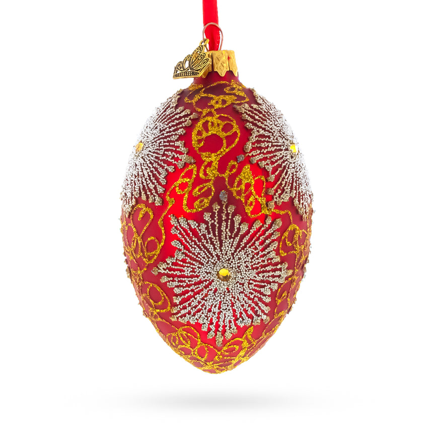 Glass Red and Gold Paisley with Silver Starburst Glass Egg Ornament 4 Inches in Red color Oval