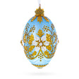 Glass Blue and Gold Embossed Floral Glass Egg Ornament in Blue color Oval