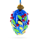 Glass Shiny Blue with Red Berry and Green Leaf Accents Mini Glass Egg Ornament 2.9 Inches in Blue color Oval