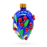 Glass Shiny Blue with Red Berry and Green Leaf Accents Mini Glass Egg Ornament in Blue color Oval