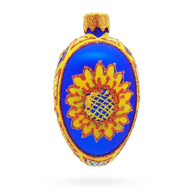 Glass Cobalt Blue with Yellow Sunflower and Red Glitter Accents Mini Glass Egg Ornament in Blue color Oval