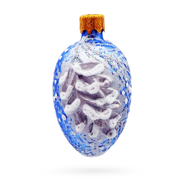 Glass Icy Blue with Silver Pinecone and Snow Design Mini Glass Egg Ornament in Blue color Oval