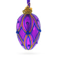 Glass Vibrant Purple with Blue and Gold Glitter Gem Accents Mini Glass Egg Ornament 2.9 Inches in Purple color Oval