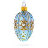 Glass Powder Blue with Gold Glitter and Pearl Accents Mini Glass Egg Ornament 2.9 Inches in Blue color Oval