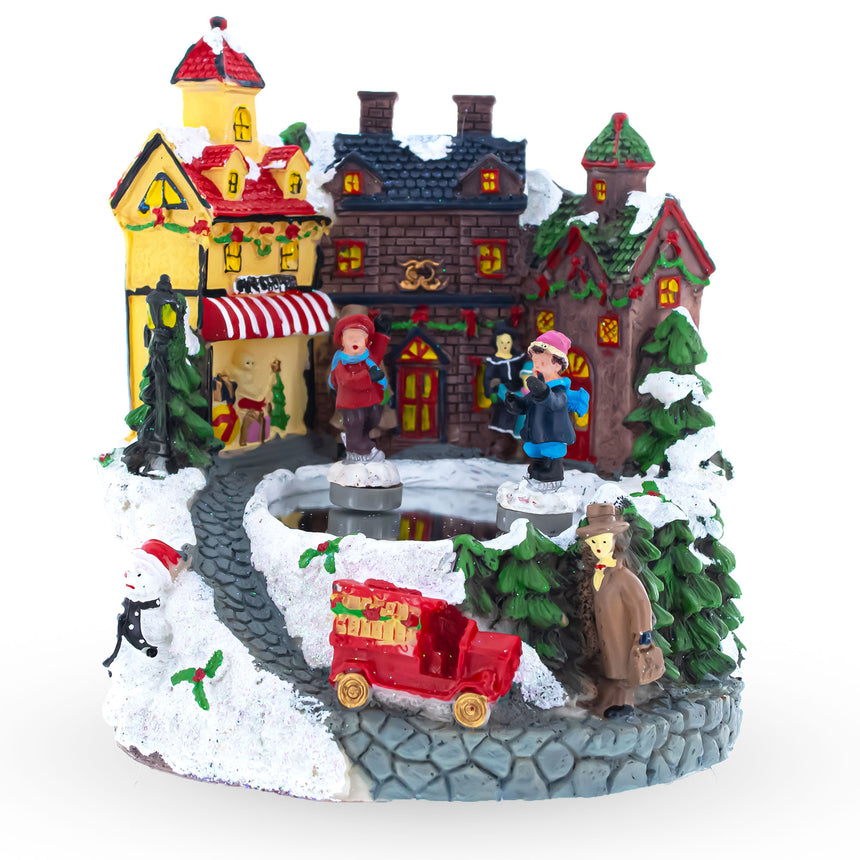 Resin Winter Village Skating Animated Musical Christmas Figurine in Multi color