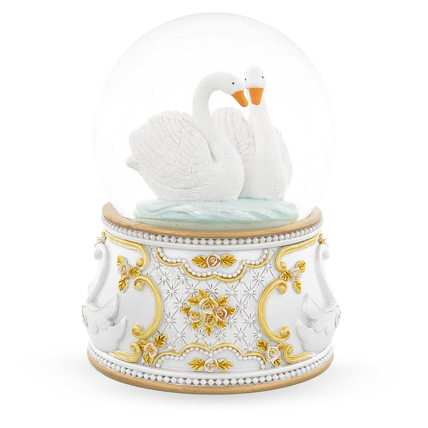 Glass Enchanted Swans Spinning Musical Water Snow Globe in White color Round