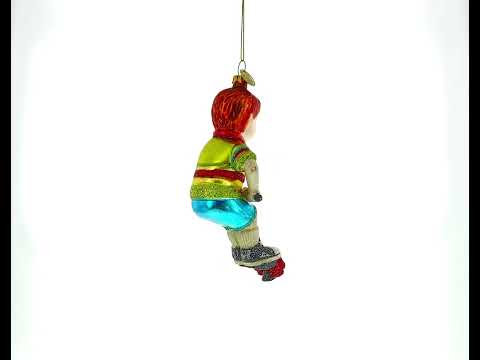 Energetic Boy on Pogo Stick Blown Glass Christmas Ornament