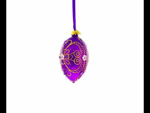 Adorno navideño de huevo de cristal dorado sobre morado, 4 pulgadas