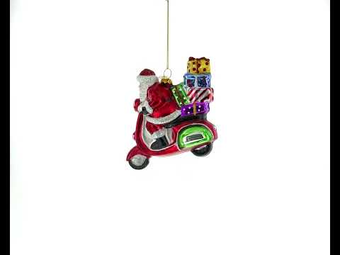 Santa Whizzing by on a Scooter with a Sack of Gifts - Blown Glass Christmas Ornament