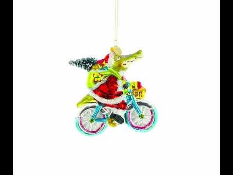 Juguetón cocodrilo montando bicicleta con regalos - Adorno navideño de vidrio soplado