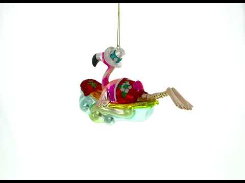 Pink Flamingo Riding a Surf Wave Glass Christmas Ornament