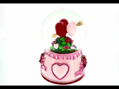 Bola de nieve musical con agua y dos corazones enamorados para el día de San Valentín