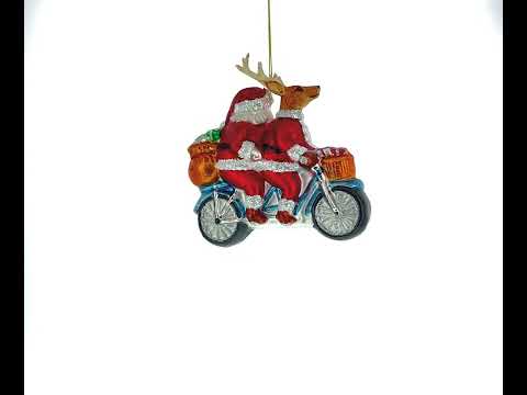 Santa and Reindeer Riding a Tandem Bike Blown Glass Christmas Ornament