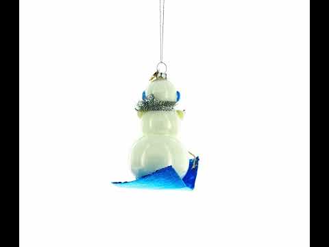 Snowman Riding a Sled Blown Glass Christmas Ornament