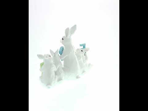 Delicia del conejito de Pascua: Figura de conejitos blancos sosteniendo letras de PASCUA