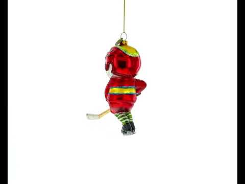 Energetic Snowman Playing Hockey Glass Christmas Ornament